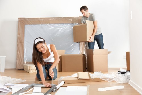 Flat removals team planning a move near Elephant and Castle apartment buildings