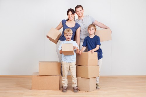Movers handling furniture and fragile items for a local relocation