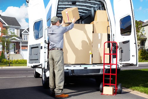 Office furniture being prepared for transport in a busy London area
