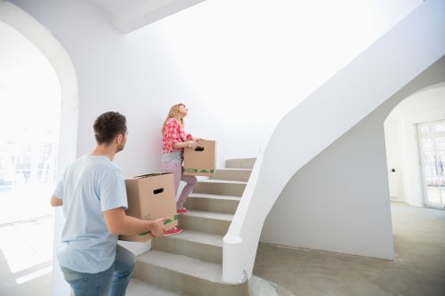 Furniture and boxes being moved with a truck service in South London
